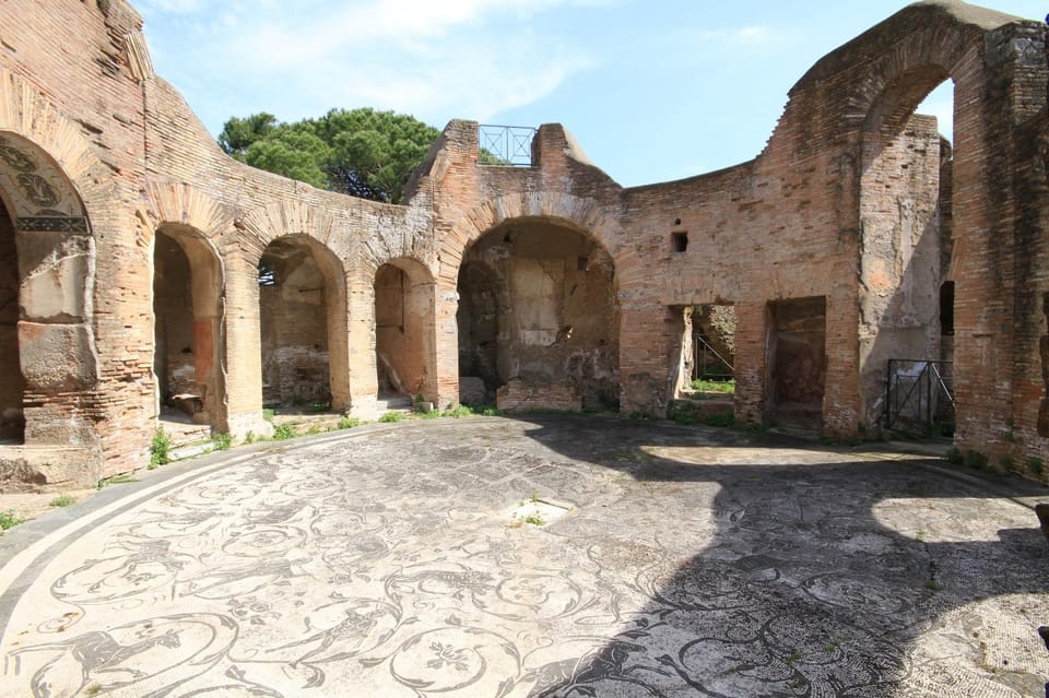 Ostia Antica: Hidden City Guided ENGLISH Tour with Transfer - Ostia Antica in 2.5 hours: baths, amphitheater, and real daily life