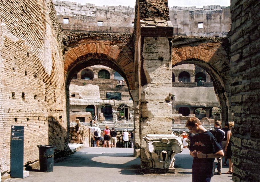 Rome: Colosseum, Forum, and Palatine Hill Guided Tour - Entering the Colosseum: Gladiators, beasts, and imperial showmanship