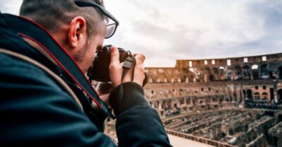 Rome: Colosseum, Roman Forum, and Palatine Hill Guided Tour - Colosseum overview: gladiators, crowds, and the elliptical walk